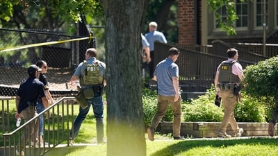 Law enforcement officers gather outside the Annunciation Church's school in response to a reported mass shooting on Wednesday, August 27, 2025, in Minneapolis. (AP) Law enforcement officers gather outside the Annunciation Church's school in response to a reported mass shooting on Wednesday, August 27, 2025, in Minneapolis. (AP)