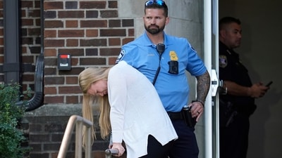 A person walks out of the Annunciation Church's school as police respond to a reported mass shooting, Wednesday, Aug. 27, 2025, in Minneapolis. (AP) A person walks out of the Annunciation Church's school as police respond to a reported mass shooting, Wednesday, Aug. 27, 2025, in Minneapolis. (AP)