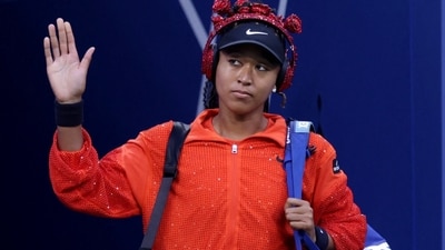 Japan's Naomi Osaka arrives before her first round match against Belgium's Greet Minnen. (REUTERS)