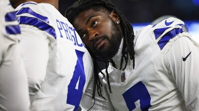 Dallas Cowboys cornerback Trevon Diggs, right, leans on quarterback Dak Prescott (4) (AP) Dallas Cowboys cornerback Trevon Diggs, right, leans on quarterback Dak Prescott (4) (AP)