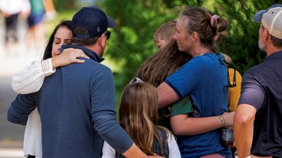Parents and relatives of the children at the school, along with community members, were seen embracing each other in distress after receiving the 'shocking' news. (Reuters)