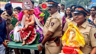 Mumbai Police personnel carry idols of Lord Ganesh on the eve of the Ganesh Chaturthi festival, in Mumbai. (PTI) Mumbai Police personnel carry idols of Lord Ganesh on the eve of the Ganesh Chaturthi festival, in Mumbai. (PTI)