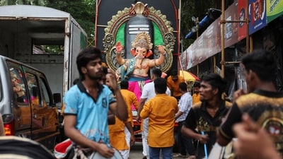 People play drums in front of an idol of the Hindu god Ganesh to celebrate the Ganesh Chaturthi festival in Mumbai. (Reuters)