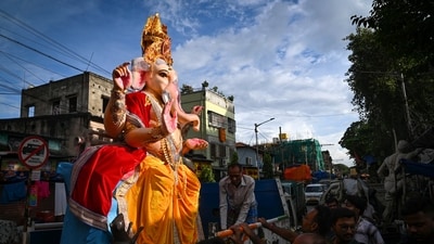 People carry an idol of Lord Ganesh in Kolkata, to celebrate the grand festival (PTI) People carry an idol of Lord Ganesh in Kolkata, to celebrate the grand festival (PTI)