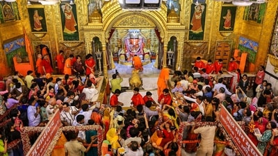 People gather to offer prayers at the Moti Dungri Ganesh Temple for the Ganesh Chaturthi festival, in Jaipur. (PTI) People gather to offer prayers at the Moti Dungri Ganesh Temple for the Ganesh Chaturthi festival, in Jaipur. (PTI)