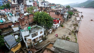 Residential buildings lie partially submerged in floodwater after heavy rain showers induced a rise in the water level of the river Tawi in Jammu on August 27, 2025. (AFP) Residential buildings lie partially submerged in floodwater after heavy rain showers induced a rise in the water level of the river Tawi in Jammu on August 27, 2025. (AFP)