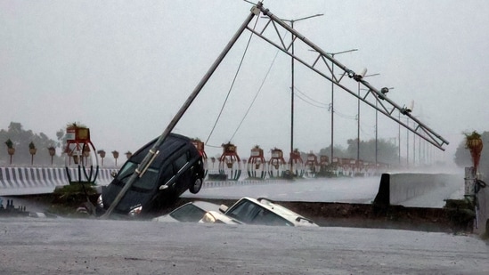 Vehicles plunge as a portion of the Fourth Tawi Bridge collapses at Bhagwati Nagar in Jammu on Tuesday. (ANI)