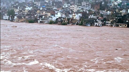 The overflowing Tawi river following heavy rainfall in Jammu on Tuesday. (Reuters)