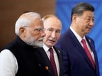 Prime Minister Narendra Modi, Russian President Vladimir Putin and Chinese President Xi Jinping attend a family photo ceremony prior to the BRICS Summit plenary session in Kazan, Russia, Wednesday, Oct. 23, 2024.
