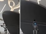 A robot waving back at a human looking at it. A robot waving back at a human looking at it.