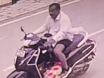 The accused, Sharan Singh, was caught on camera taking the torso of his nephew on his scooter. (Sourced) The accused, Sharan Singh, was caught on camera taking the torso of his nephew on his scooter. (Sourced)