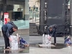 A clip from Toronto showed a homeless man washing at a public fountain. A clip from Toronto showed a homeless man washing at a public fountain.