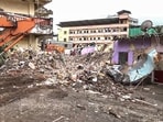 Rescue operation underway after a four-storey unauthorised building collapsed onto adjacent vacant chawl, at Virar, in Mumbai