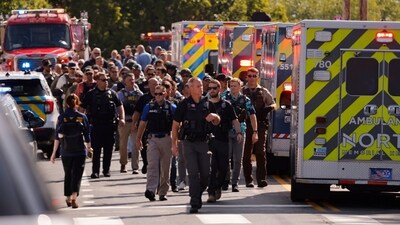Law enforcement officers assembled outside Annunciation Church’s school on Wednesday following reports of a mass shooting in Minneapolis. AP/PTI(AP08_28_2025_000059B) (AP) Law enforcement officers assembled outside Annunciation Church’s school on Wednesday following reports of a mass shooting in Minneapolis. AP/PTI(AP08_28_2025_000059B) (AP)