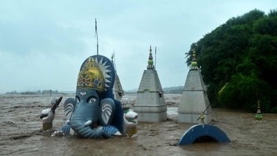 A temple with an statue of Lord Ganesh in Jammu lies submerged by the floodwaters of Tawi, as fierce monsoons have been lashing the region since Tuesday. (AFP) A temple with an statue of Lord Ganesh in Jammu lies submerged by the floodwaters of Tawi, as fierce monsoons have been lashing the region since Tuesday. (AFP)