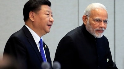 China's President Xi Jinping and Prime Minister Narendra Modi arrive for a signing ceremony during Shanghai Cooperation Organization (SCO) summit in Qingdao, Shandong Province, China June 10, 2018. (REUTERS)