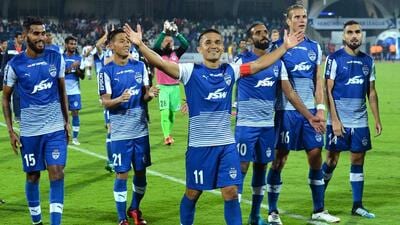 File image of Bengaluru FC captain Sunil Chhetri (C) celebrating with his teammates after their victory against Atletico de Kolkata at the end of their Hero Indian Super League (ISL) in 2018. (AFP) File image of Bengaluru FC captain Sunil Chhetri (C) celebrating with his teammates after their victory against Atletico de Kolkata at the end of their Hero Indian Super League (ISL) in 2018. (AFP)