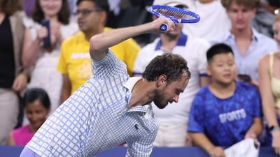 A frustrated Daniil Medvedev smashes his racket towards the end of his first round loss vs Benjamin Bonzi. (Getty Images via AFP) A frustrated Daniil Medvedev smashes his racket towards the end of his first round loss vs Benjamin Bonzi. (Getty Images via AFP)