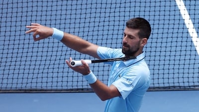 Novak Djokovic celebrates his win over Zachary Svajda with a violin celebration dedicated to his daughter. (Getty Images via AFP) Novak Djokovic celebrates his win over Zachary Svajda with a violin celebration dedicated to his daughter. (Getty Images via AFP)