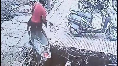 Ghaziabad municipal corporation confirmed that the incident took place at a market near Gaur Green City, Kala Patthar Road, in Indirapuram, and the drain was about 8-10-feet deep. (Video grab/HT Photos) Ghaziabad municipal corporation confirmed that the incident took place at a market near Gaur Green City, Kala Patthar Road, in Indirapuram, and the drain was about 8-10-feet deep. (Video grab/HT Photos)