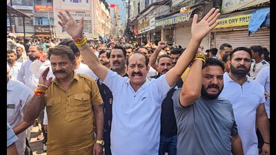 People hold a protest against the Shri Mata Vaishno Devi Shrine Board following the death of pilgrims due to landslide and heavy rainfall, at Katra, in Reasi, on Thursday. (PTI) People hold a protest against the Shri Mata Vaishno Devi Shrine Board following the death of pilgrims due to landslide and heavy rainfall, at Katra, in Reasi, on Thursday. (PTI)
