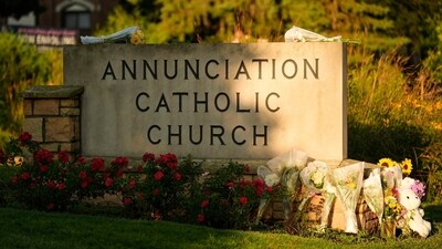 Crosses, flowers, and mementos were placed at Annunciation Catholic Church on Thursday, creating a heartfelt memorial for the victims of Wednesday’s school shooting in Minneapolis. (AP Photo/Abbie Parr) (AP) Crosses, flowers, and mementos were placed at Annunciation Catholic Church on Thursday, creating a heartfelt memorial for the victims of Wednesday’s school shooting in Minneapolis. (AP Photo/Abbie Parr) (AP)