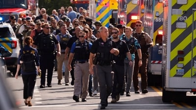 Law enforcement officers gather outside the Annunciation Church's school in response to a reported mass shooting, Wednesday, Aug. 27, 2025, in Minneapolis. (AP Photo/Bruce Kluckhohn) (AP) Law enforcement officers gather outside the Annunciation Church's school in response to a reported mass shooting, Wednesday, Aug. 27, 2025, in Minneapolis. (AP Photo/Bruce Kluckhohn) (AP)