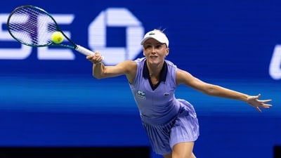 Russia's Polina Kudermetova stunned in a powder blue sleeveless pleated tennis dress with a structure V-neckline and navy blue collars from Lacoste, while up against Aryna Sabalenka of Belarus. (Reuters)