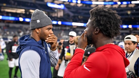 Dallas Cowboys defensive end Micah Parsons, left, and Atlanta Falcons linebacker Jalon Walker chat following a preseason NFL football game Friday, Aug. 22 (AP)