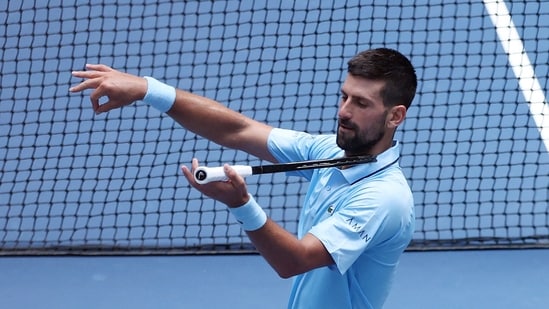 Novak Djokovic celebrates his win over Zachary Svajda with a violin celebration dedicated to his daughter. (Getty Images via AFP)