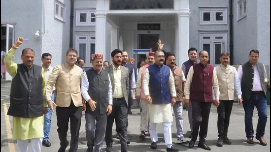 Leader of opposition Jairam Thakur along with BJP legislators raising slogans outside the Himachal Pradesh Vidhan Sabha during the monsoon session in Shimla on Thursday. (Deepak Sansta/HT)
