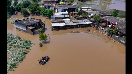 Partially submerged houses at a flood-ravaged area in Gurdaspur . (PTI)