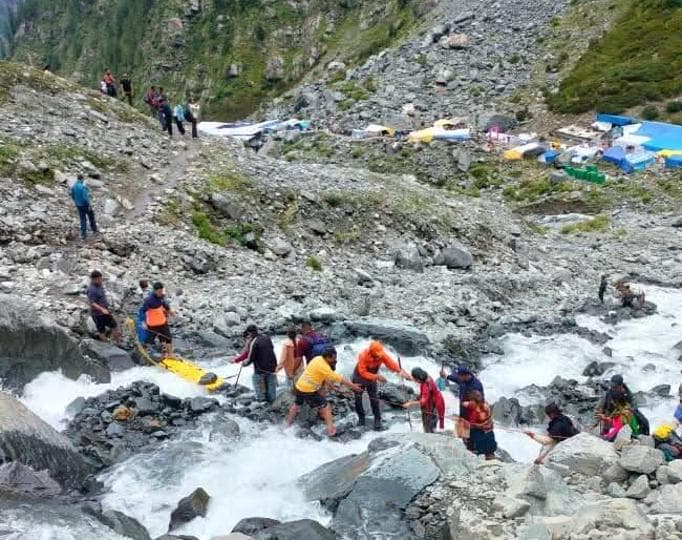 National Disaster Response Force (NDRF) personnel rescuing pilgrims on the way to Manimahesh in Chamba district on Thursday. (HT Photo) National Disaster Response Force (NDRF) personnel rescuing pilgrims on the way to Manimahesh in Chamba district on Thursday. (HT Photo)