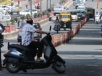 A two-wheeler rider take a U-turn to avoid being penalised for not wearing a helmet in Bhopal. (HT File Photo) A two-wheeler rider take a U-turn to avoid being penalised for not wearing a helmet in Bhopal. (HT File Photo)