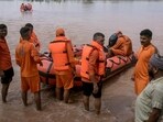 National Disaster Response Force (NDRF) personnel prepare to patrol a flooded area on a boat after a rise in water level of the Ravi river following heavy rains at a village near Ramdas, about 45 km from Amritsar on Thursday. (AFP)