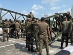 The Indian Army swiftly constructed a 110-foot bailey bridge over the Tawi River in Jammu city within 12 hours after a section of the <span class='webrupee'>₹</span>147 crore fourth bridge collapsed due to heavy rainfall on Tuesday. (HT photo) The Indian Army swiftly constructed a 110-foot bailey bridge over the Tawi River in Jammu city within 12 hours after a section of the <span class='webrupee'>₹</span>147 crore fourth bridge collapsed due to heavy rainfall on Tuesday. (HT photo)