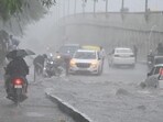 Traffic chaos on the waterlogged NH-24 near Mayur Vihar Phase-2 after the rain on Friday morning. (Ajay Aggarwal/HT photo)