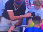 The video from US Open showed the grown man take the cap from the kid, which Kamil Majchrzak had given him.