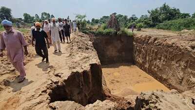 Deep pit created by alleged illegal mining by Batriana village sarpanch in Sangrur. (HT Photo) Deep pit created by alleged illegal mining by Batriana village sarpanch in Sangrur. (HT Photo)