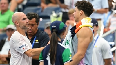 USA's Ben Shelton and France's Adrian Mannarino shake hands after Shelton retired during their men's singles third round match on day six of the US Open (AFP)