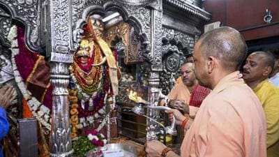 Uttar Pradesh chief minister Yogi Adityanath offering prayers at Kaal Bhairav temple in Varanasi on Friday. (PTI PHOTO) Uttar Pradesh chief minister Yogi Adityanath offering prayers at Kaal Bhairav temple in Varanasi on Friday. (PTI PHOTO)