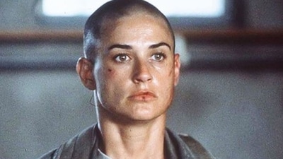 Demi Moore shaved her head on-camera for her role as Lt. Jordan O'Neil in GI Jane. For her character as the first woman to train for the Navy Seals, the actress underwent a complete physical and mental transformation and her performance was applauded widely. Demi Moore shaved her head on-camera for her role as Lt. Jordan O'Neil in GI Jane. For her character as the first woman to train for the Navy Seals, the actress underwent a complete physical and mental transformation and her performance was applauded widely.