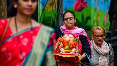 Women in Mumbai arrived carrying idols of Lord Ganesha, to participate in the Visarjan ceremonies on August 28. The immersion was conducted in an artificial pond. (PTI) Women in Mumbai arrived carrying idols of Lord Ganesha, to participate in the Visarjan ceremonies on August 28. The immersion was conducted in an artificial pond. (PTI)