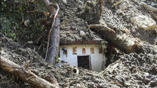 Debris scattered around a disaster-hit area following heavy rainfall in Chamoli, Uttarakhand, on Sunday. (PTI)