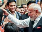 Prime Minister Narendra Modi embraces a child during a rousing welcome from the Indian community upon his arrival at a hotel, in Tianjin on Saturday.