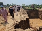 Deep pit created by alleged illegal mining by Batriana village sarpanch in Sangrur. (HT Photo) Deep pit created by alleged illegal mining by Batriana village sarpanch in Sangrur. (HT Photo)