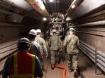 Rear Adm. John Korka, Commander, Naval Facilities Engineering Systems Command (NAVFAC), and Chief of Civil Engineers, leads Navy and civilian water quality recovery experts through the tunnels of the Red Hill Bulk Fuel Storage Facility, near Pearl Harbor, Hawaii, on Dec. 23, 2021. Rear Adm. John Korka, Commander, Naval Facilities Engineering Systems Command (NAVFAC), and Chief of Civil Engineers, leads Navy and civilian water quality recovery experts through the tunnels of the Red Hill Bulk Fuel Storage Facility, near Pearl Harbor, Hawaii, on Dec. 23, 2021.