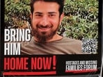 This photo shows a poster bearing a portrait of Idan Shtivi, one of the Israelis held hostage in the Gaza Strip since October 2023, set up in a square in Tel Aviv on January 21, 2025. 