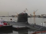 Indian naval soldiers attend the commissioning ceremony of the INS third Scorpene-Class submarine 'Karanj' as boat carrying naval personnel passes by in Mumbai, India, Wednesday, March 10, 2021. (AP Photo/Rafiq Maqbool) (AP) Indian naval soldiers attend the commissioning ceremony of the INS third Scorpene-Class submarine 'Karanj' as boat carrying naval personnel passes by in Mumbai, India, Wednesday, March 10, 2021. (AP Photo/Rafiq Maqbool) (AP)