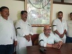 UP Congress president Ajay Rai (seated) sporting a black band (HT Photo) UP Congress president Ajay Rai (seated) sporting a black band (HT Photo)